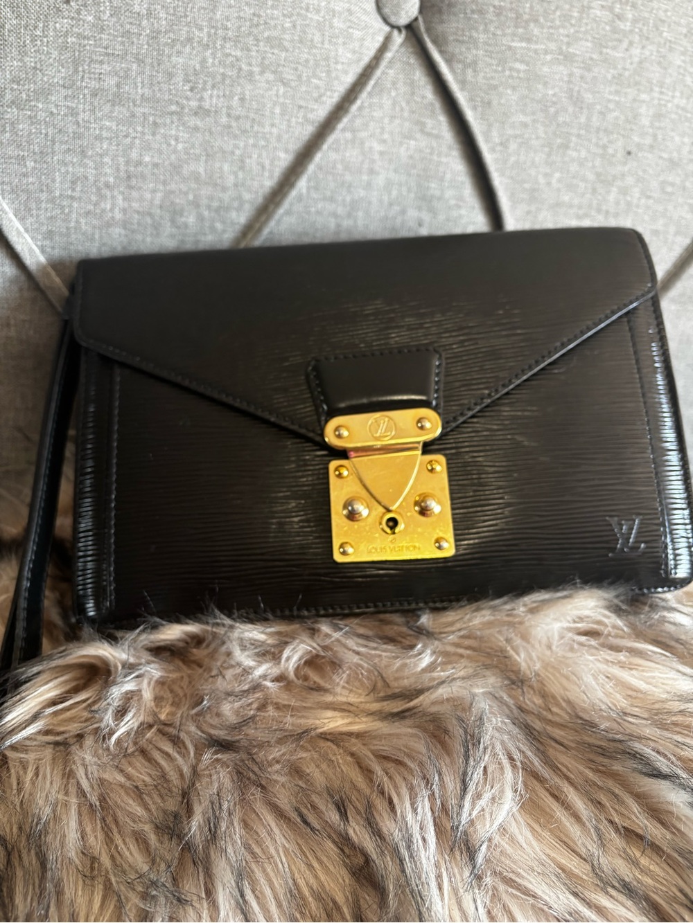 Louis Vuitton Black Epi Leather clutch with Gold Tone Lock